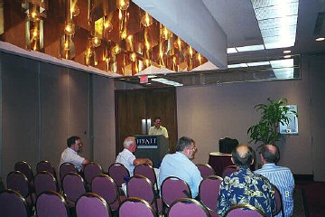 [Ronald Hollinger chairing 1999 meeting]