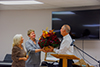 2020 October: Darlene presenting flowers to Terry and Wanda